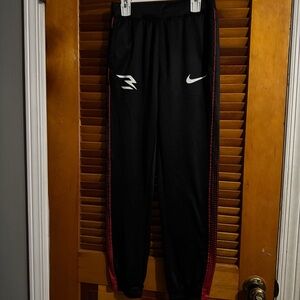 Nike Kids Black Joggers with Red Stripes